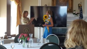 Amanda received an award and bouquet